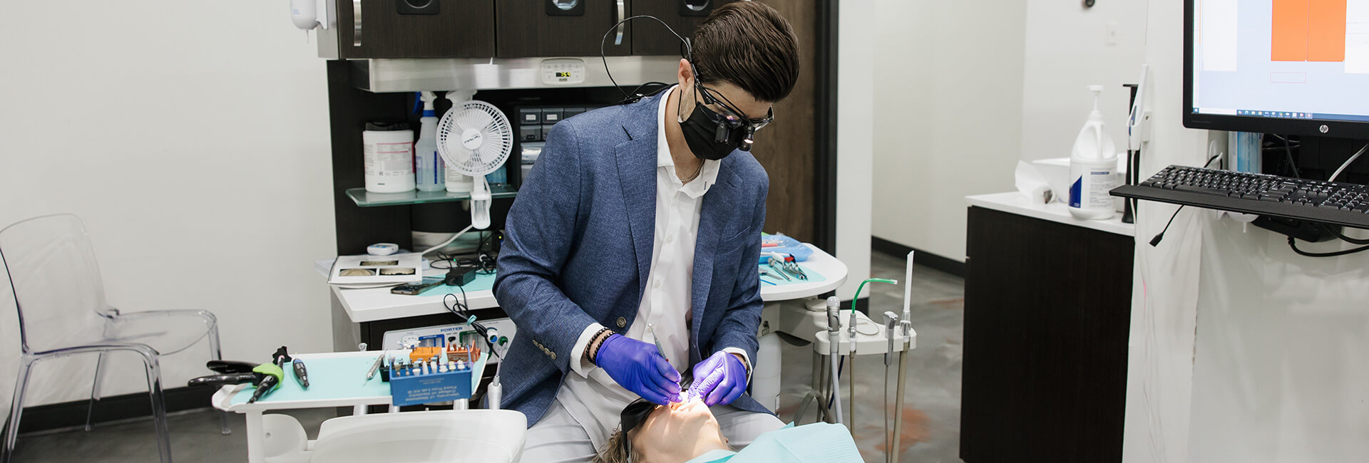 Dr. Barton checking a patient at Intentional Smiles, OK