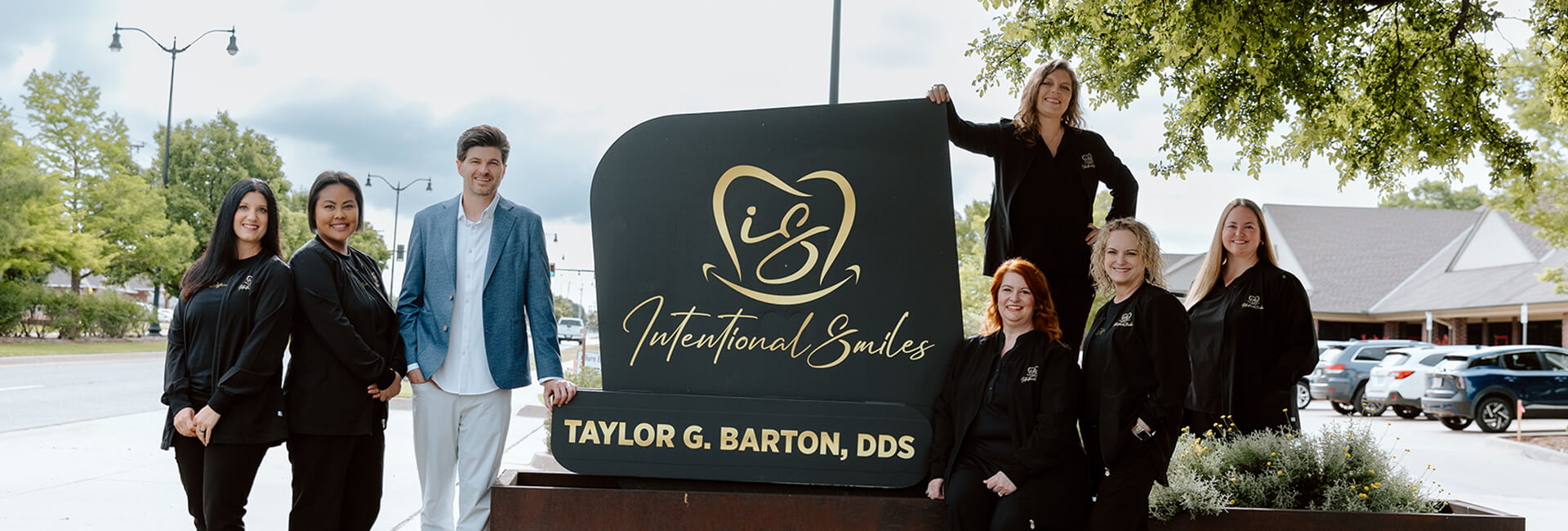 Team at outside of the Intentional Smiles, OK